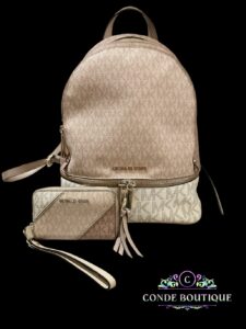 Authentic Michael kor backpack with matching small wallet.